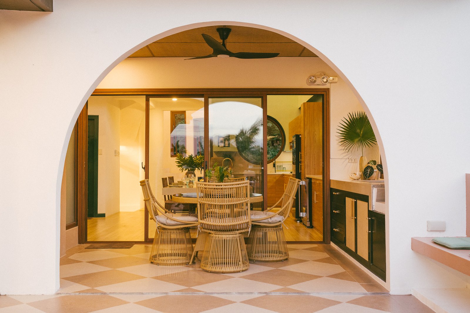 Arched doorway into Palm Villa's warm dining area