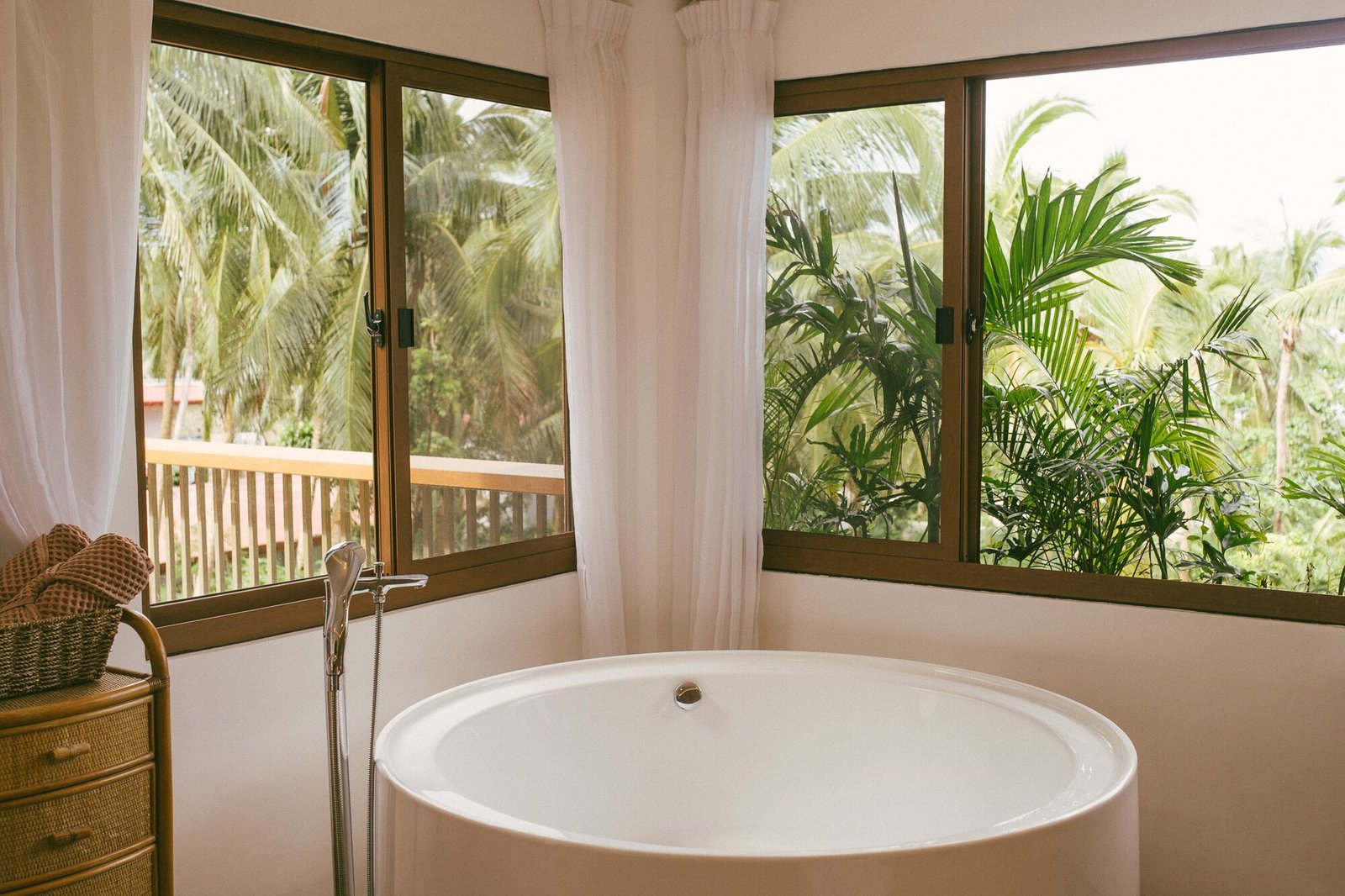 Freestanding soaking tub with jungle views